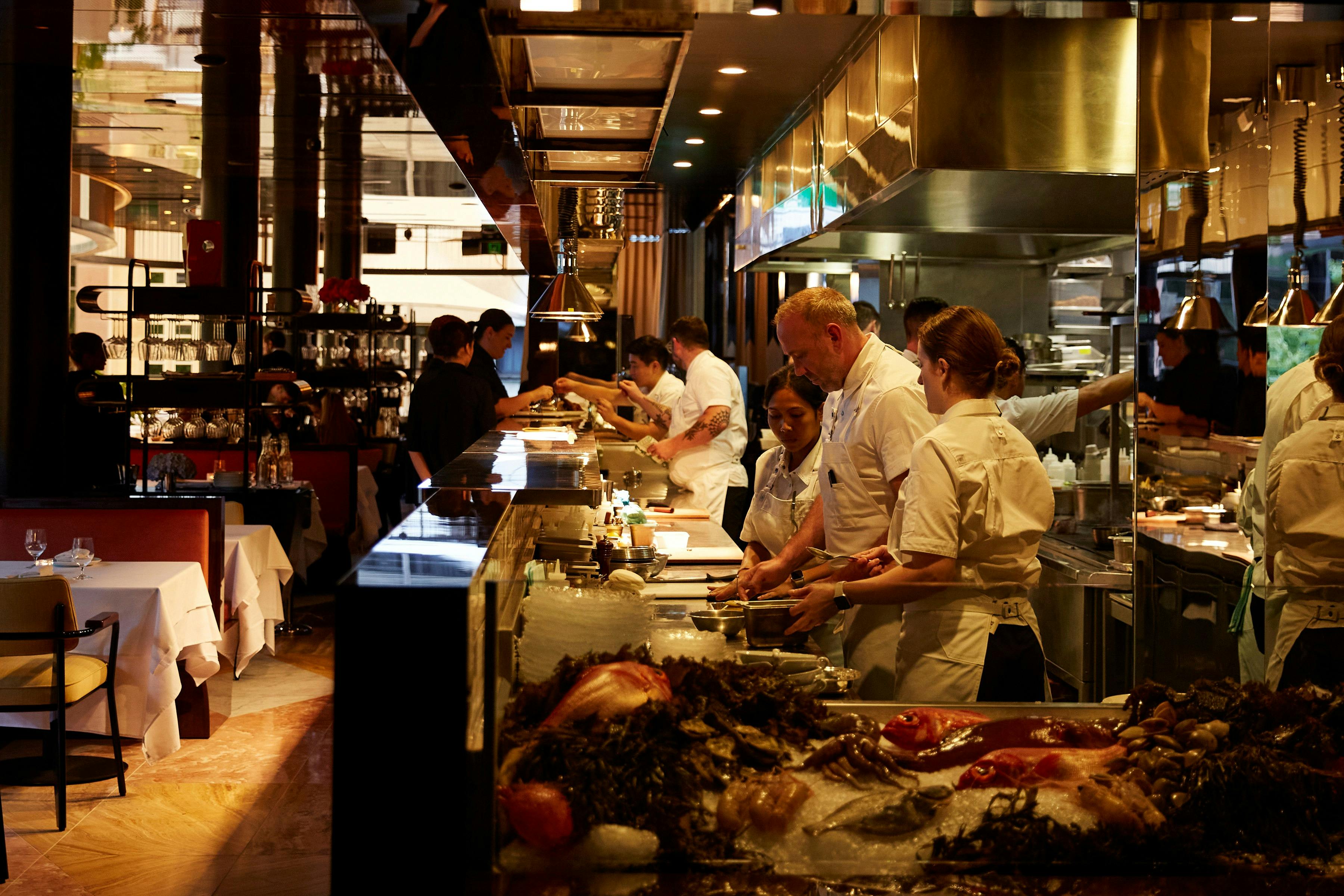 Chefs cooking in a luxurious fine dining kitchen