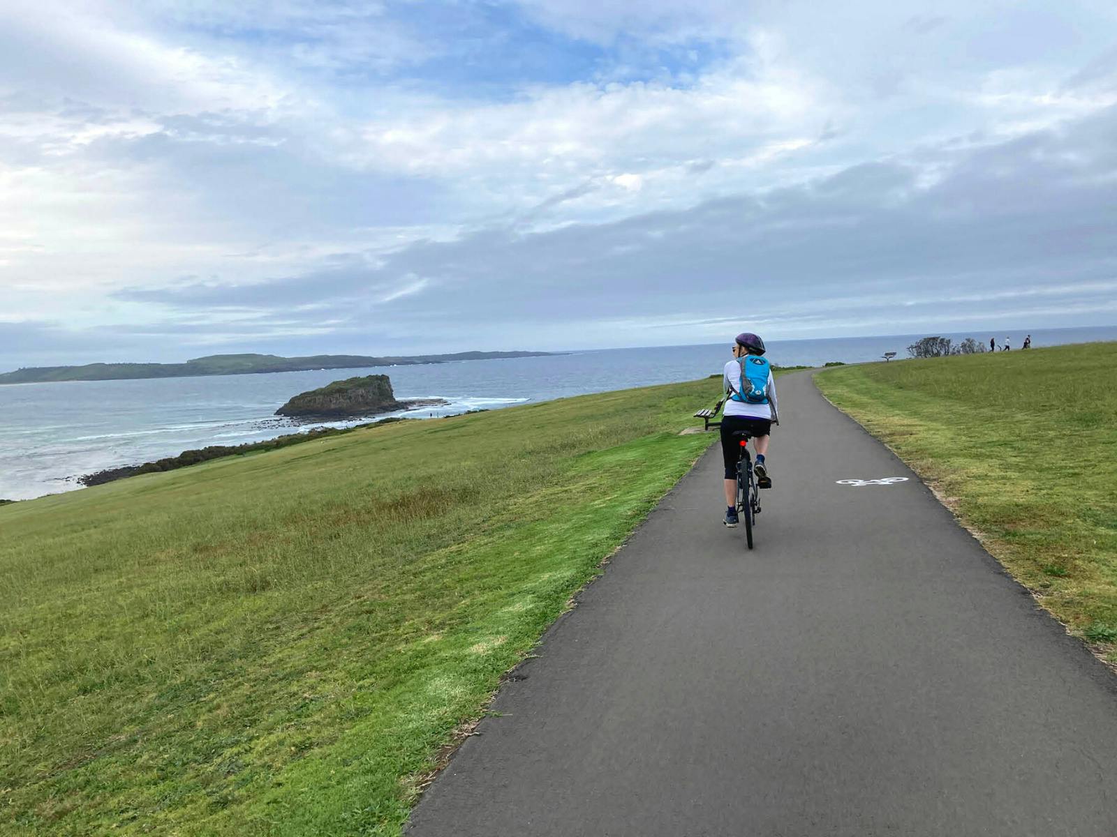 Cyclist taking in the views on the route to Kiama.