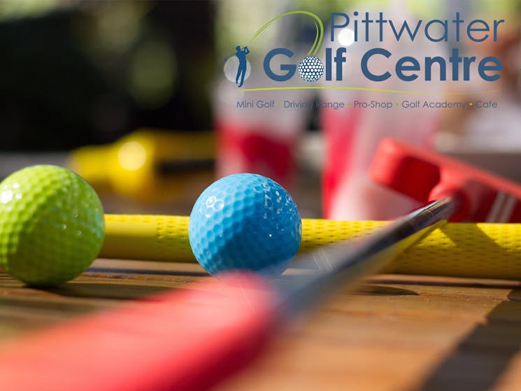 Pittwater Golf Centre - Mini Golf clubs and balls sitting on cafe table with our juice smoothies