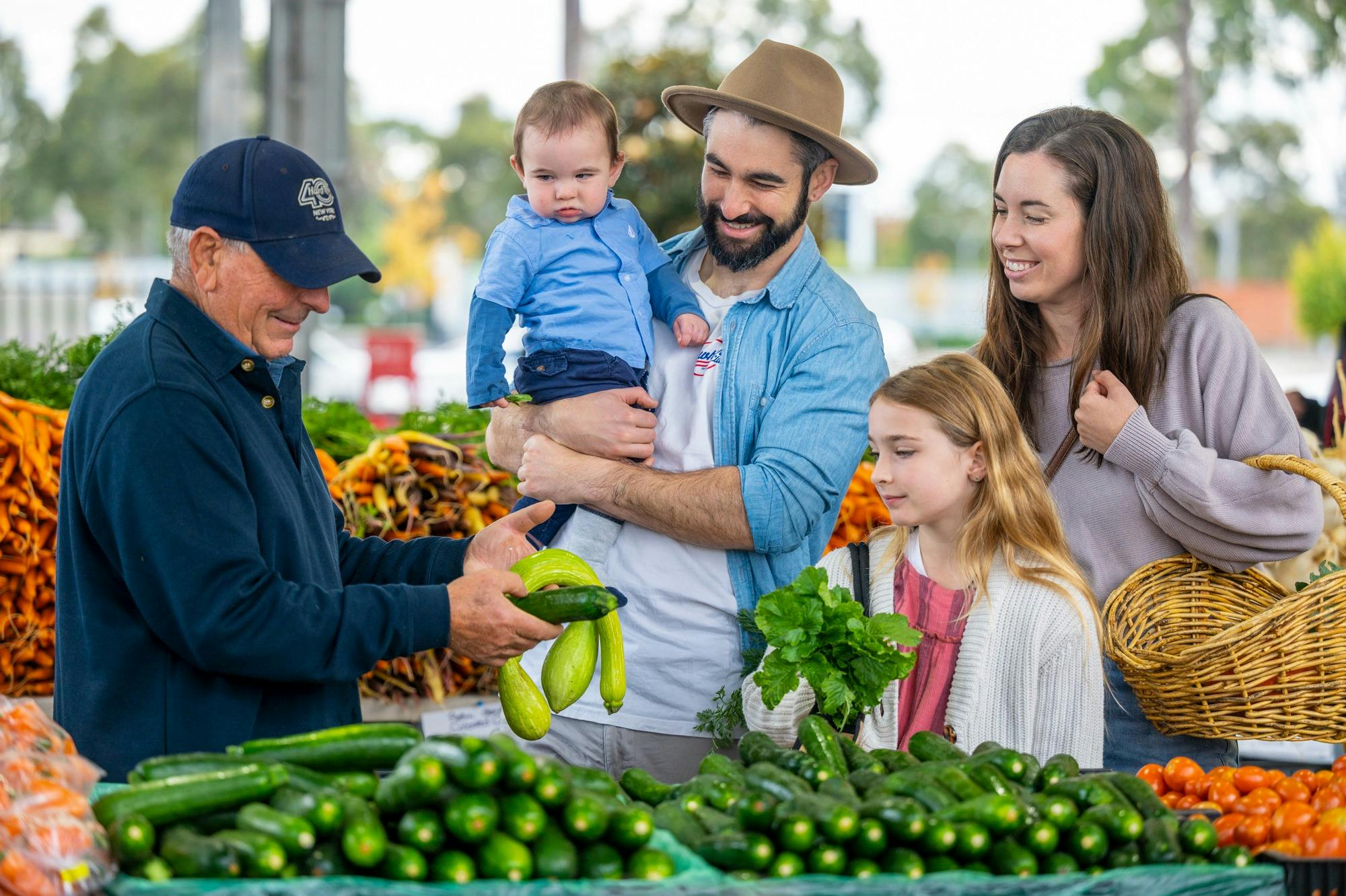 Family Learning about Produce with Farmer
