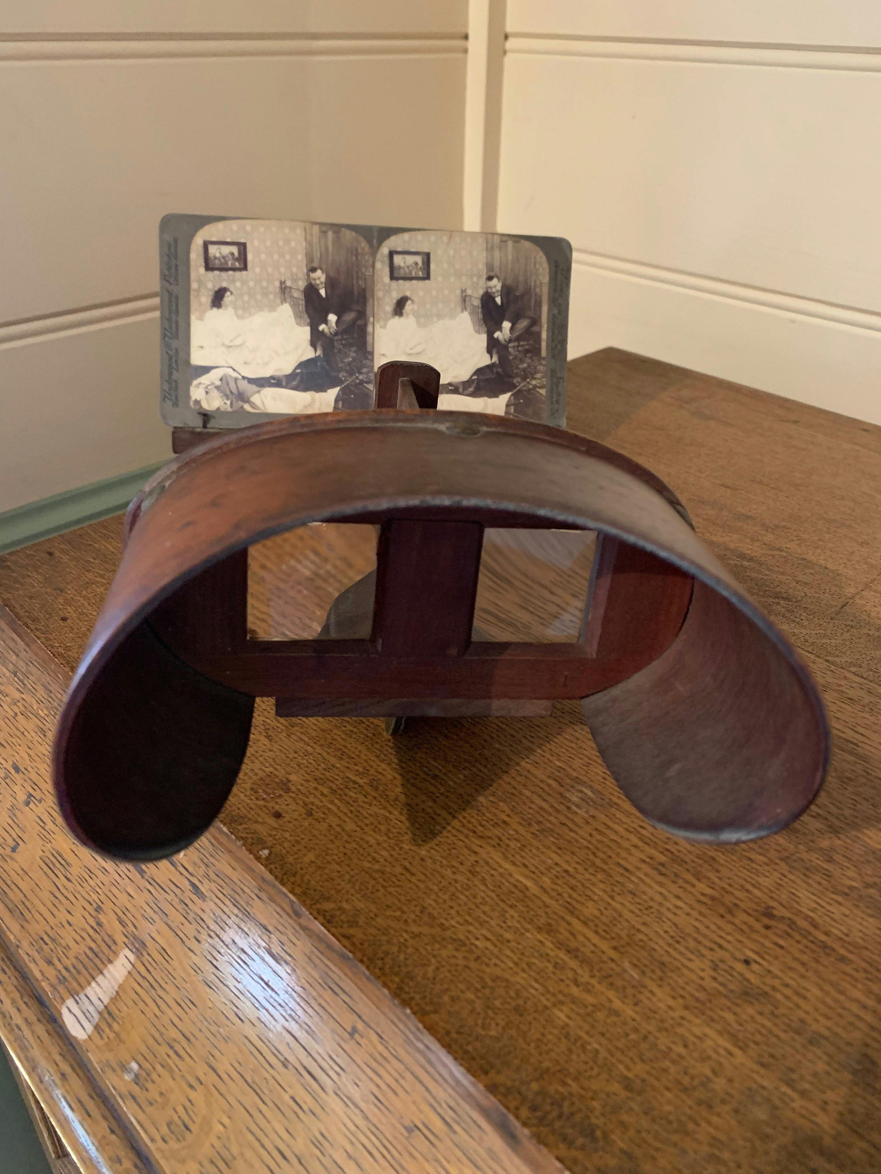 A stereoscope -use to  look at 3-D photographs. There is a wide selection to tempt the visitor