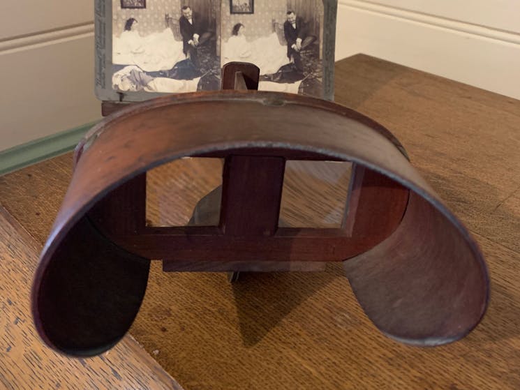 A stereoscope -use to  look at 3-D photographs. There is a wide selection to tempt the visitor