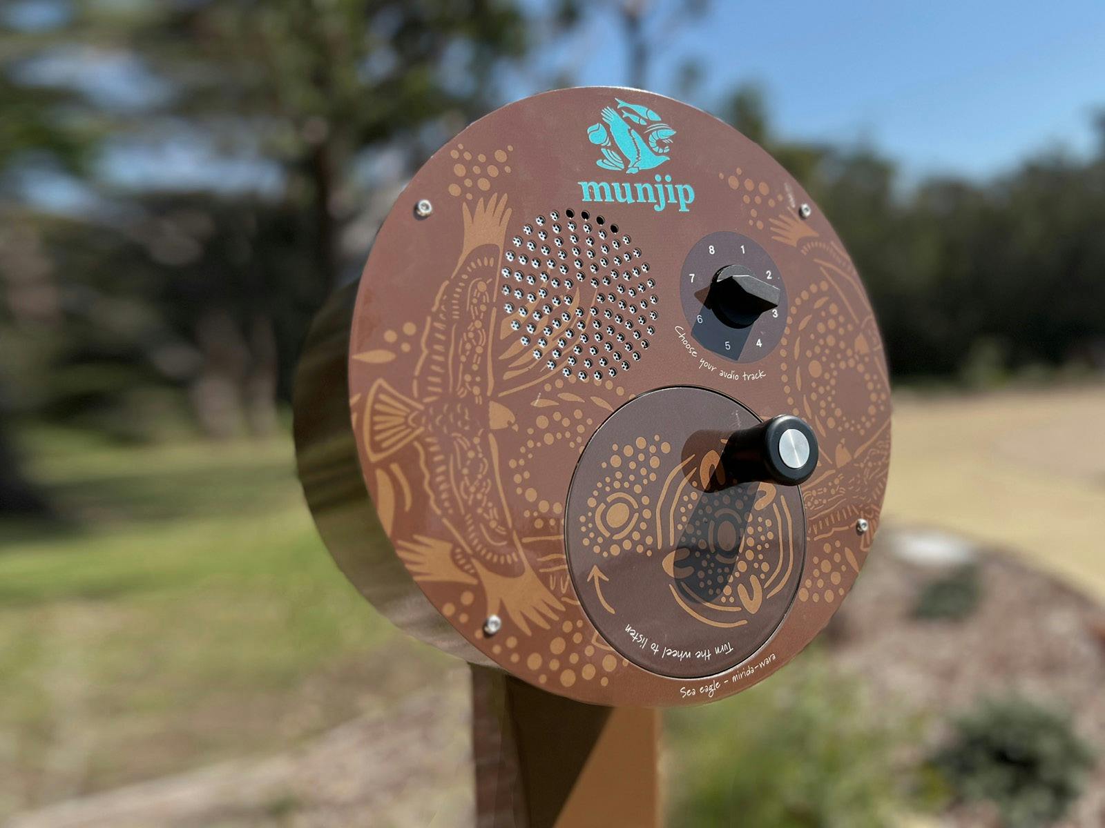 an audio post decorated with aboriginal designs