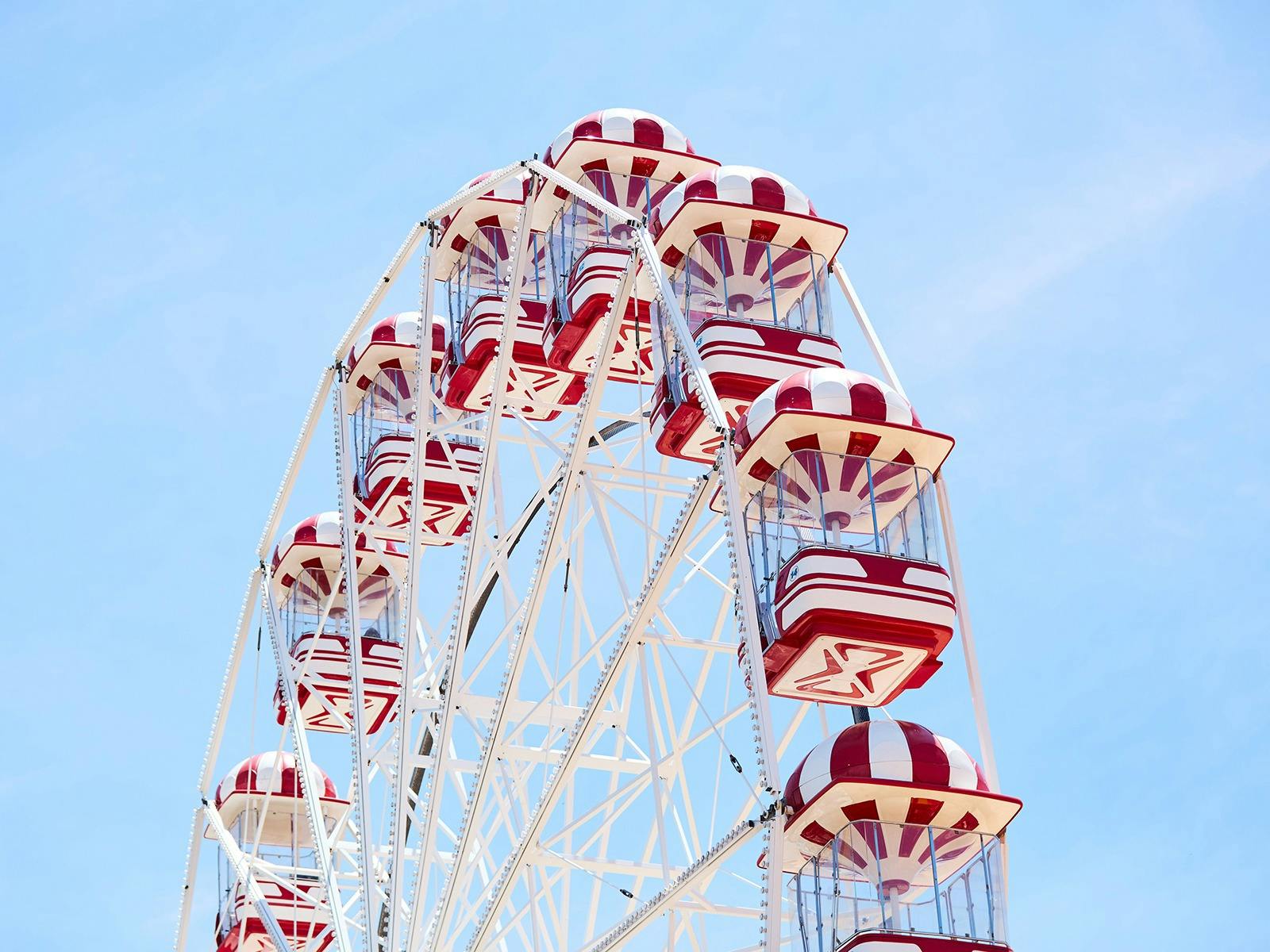 Ferris wheel with blue sky background