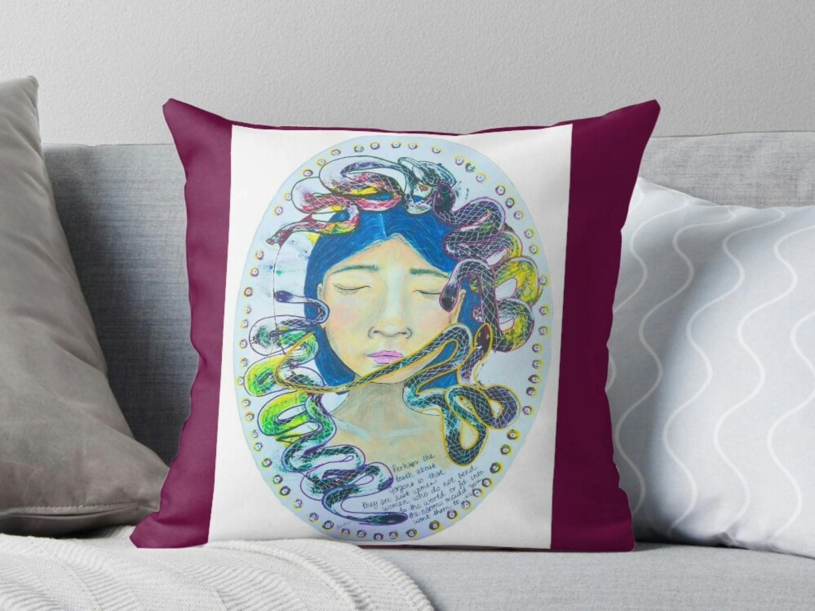 A cushion with Medusa painted by Jade Forder