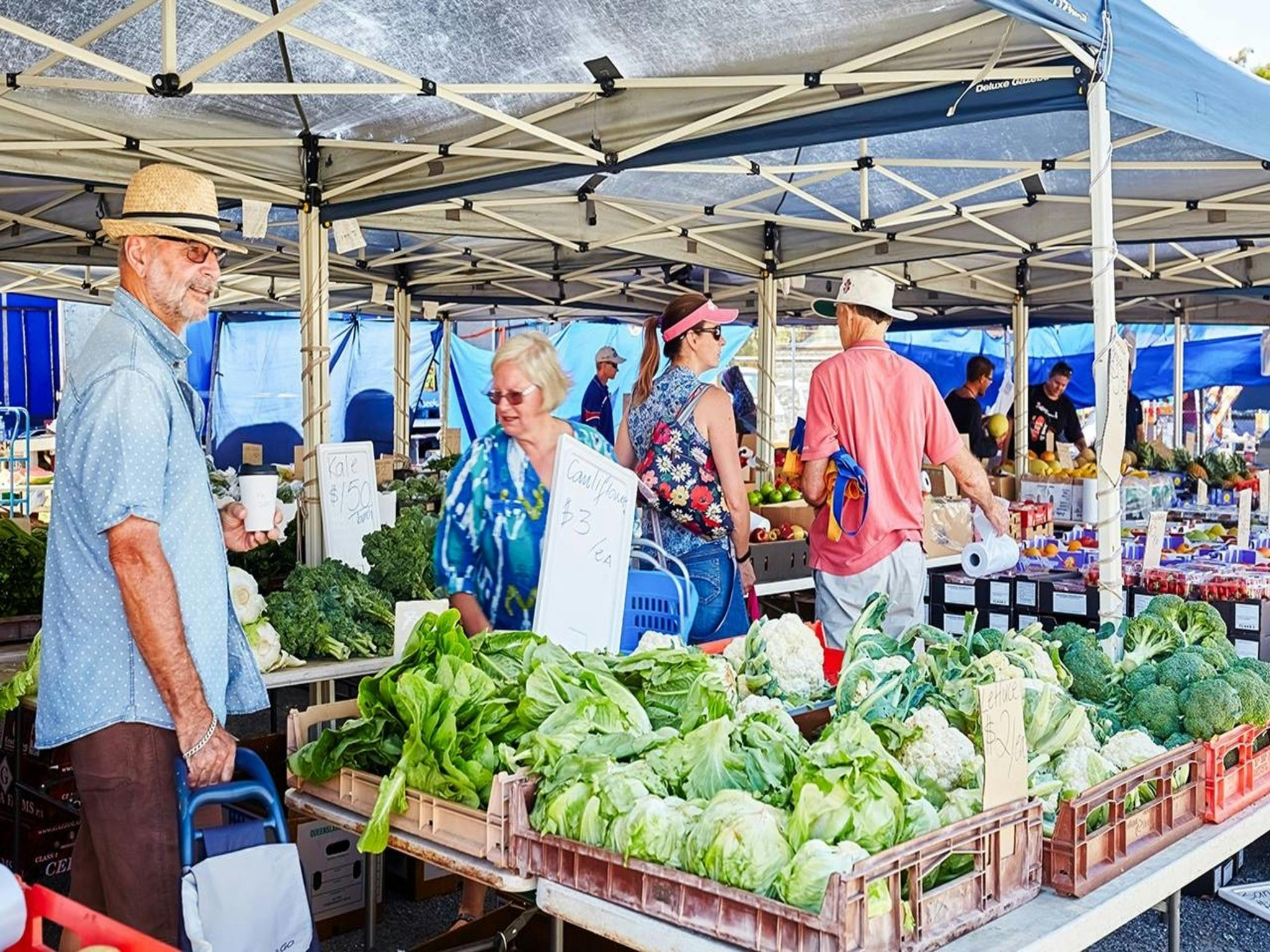 People looking a fresh produce. People looking a fresh produce.