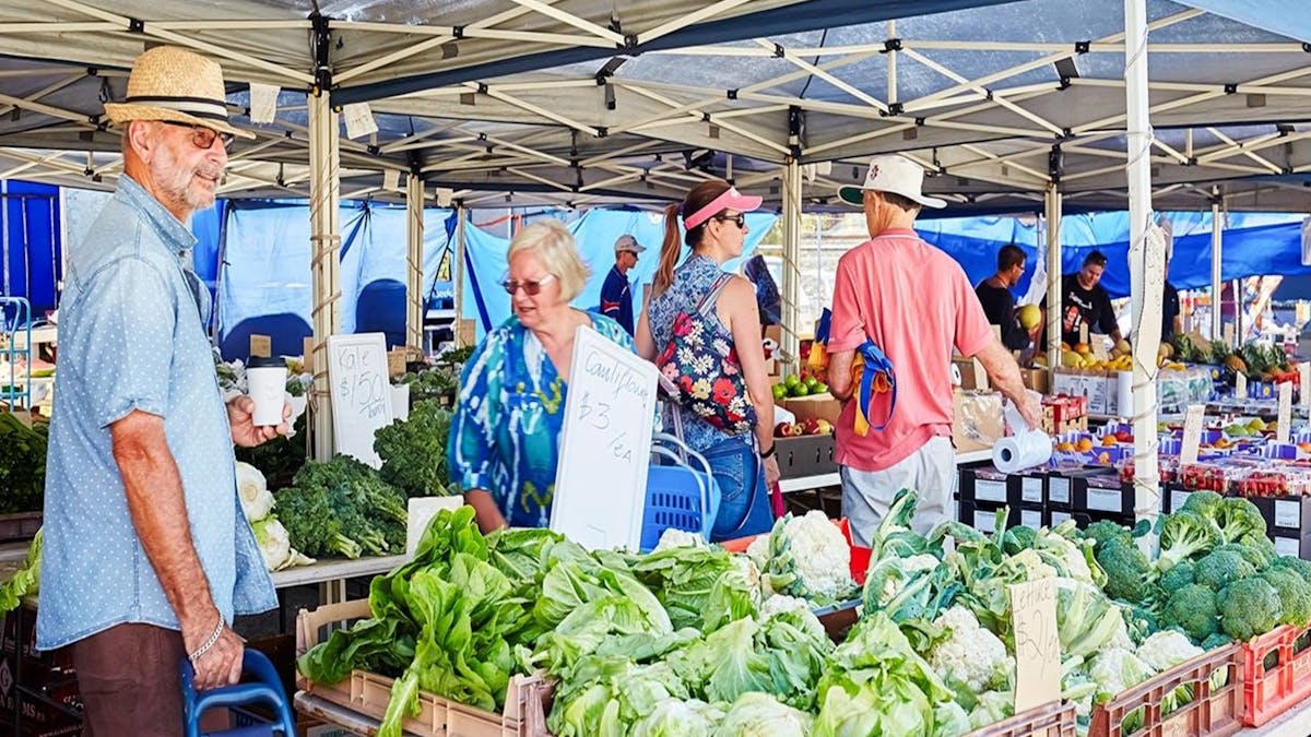 People looking a fresh produce.