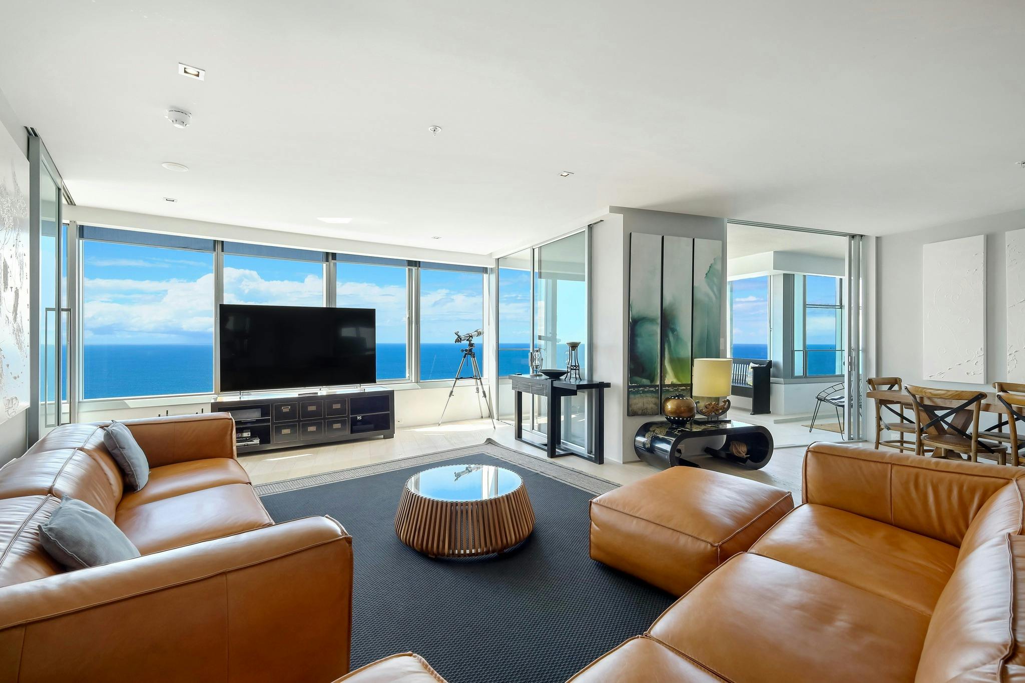 Lounge room with TV and ocean view - Q1 Resort and Residences - Surfers Paradise