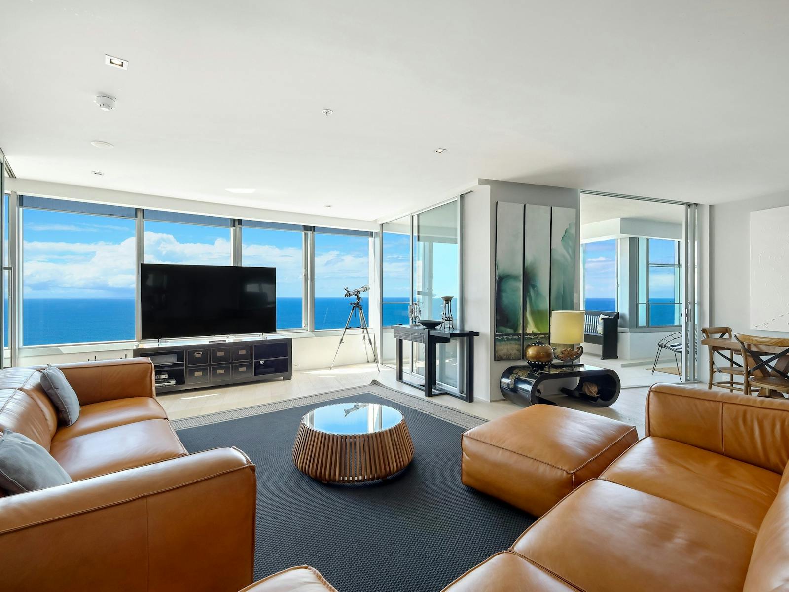 Lounge room with TV and ocean view - Q1 Resort and Residences - Surfers Paradise Lounge room with TV and ocean view - Q1 Resort and Residences - Surfers Paradise