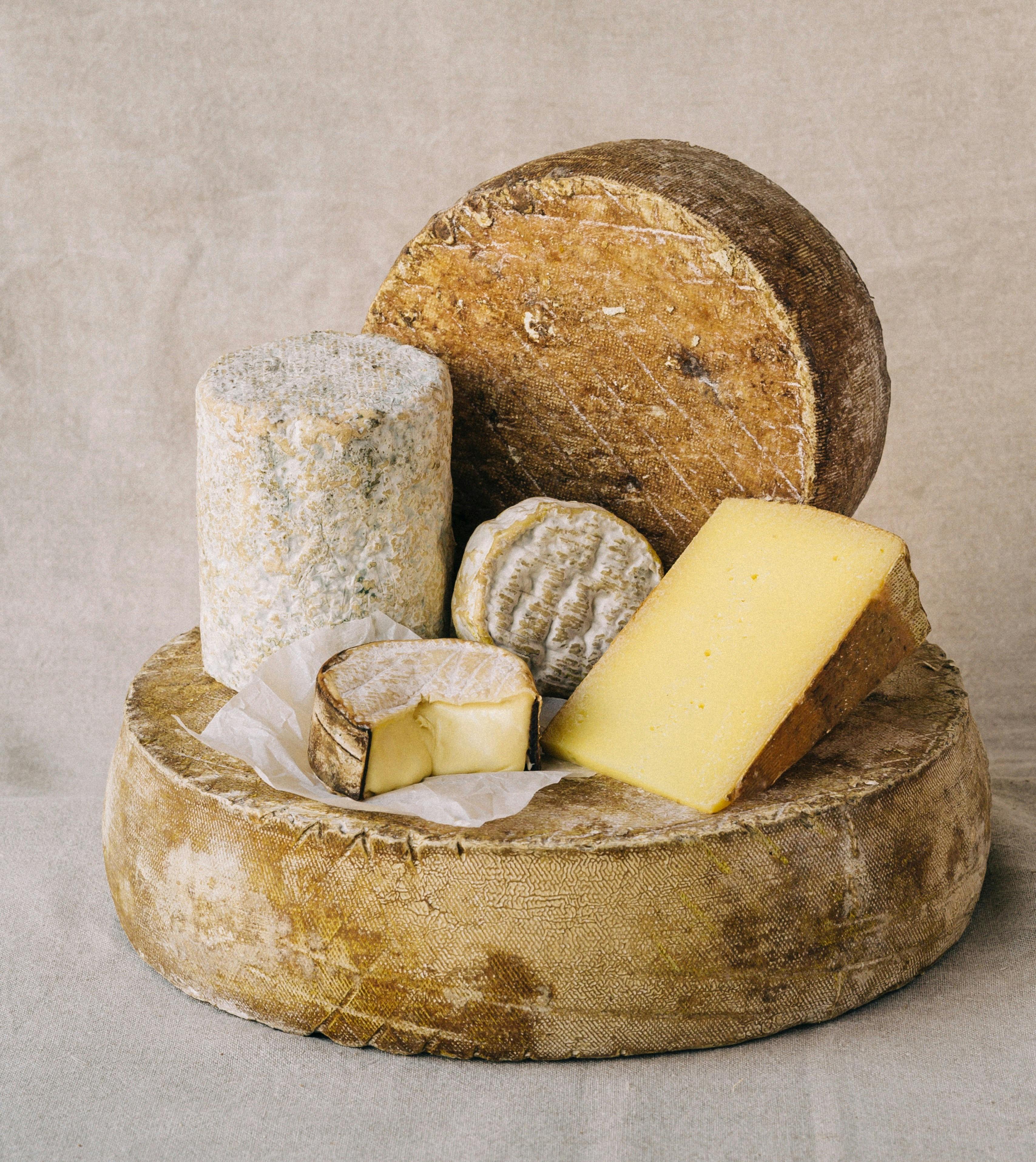 stack of different types of artisan cheeses