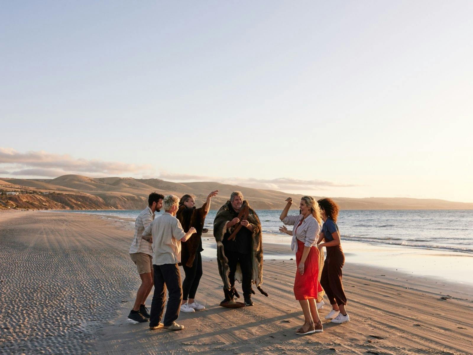People dancing on a beach