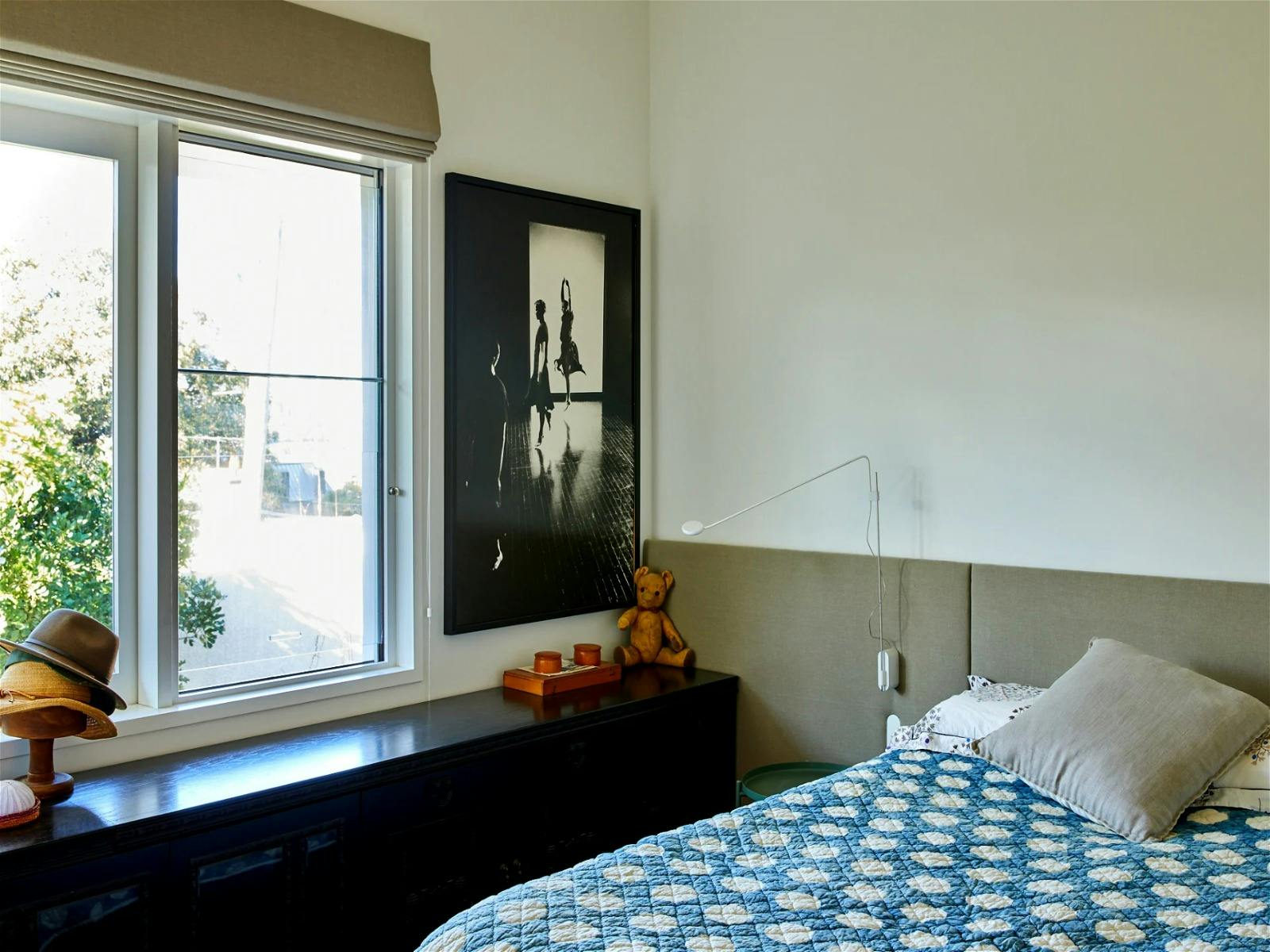 Guest suite with a dedicated desk space and a cleverly designed en-suite bathroom