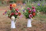 White jugs with fresh flowers picked from the farm