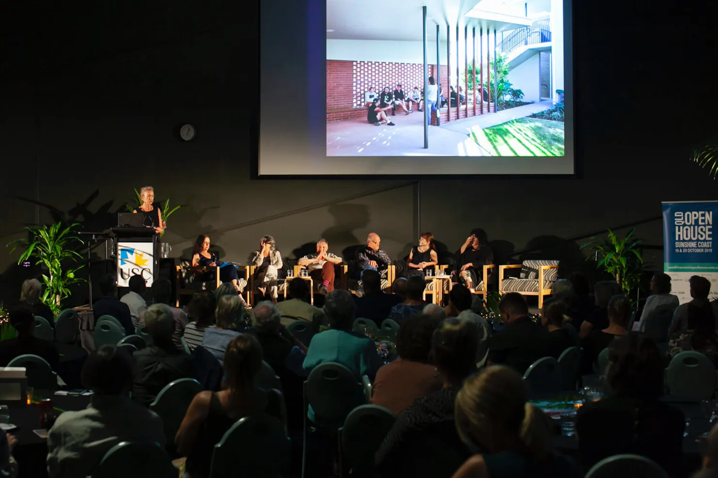 Speakers in a panel discussion