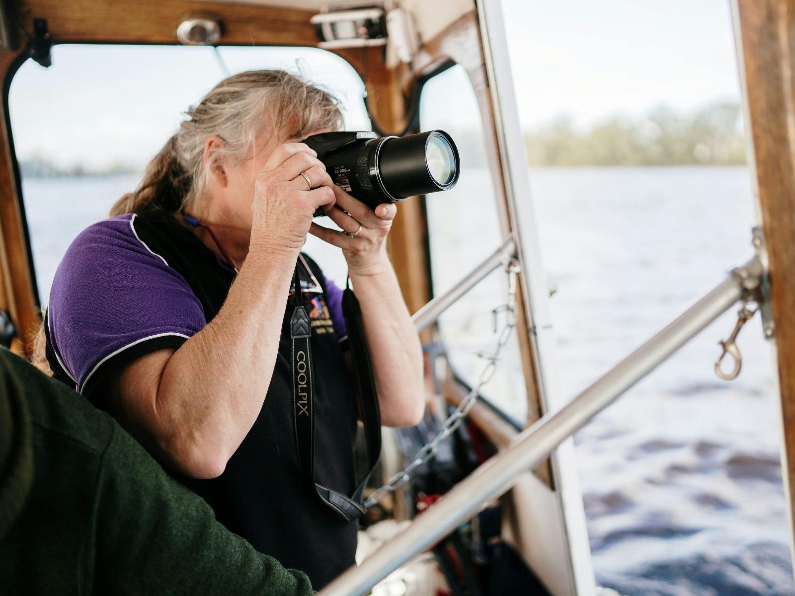 Kim (owner) taking photos of scenery while on Jus' Leven.