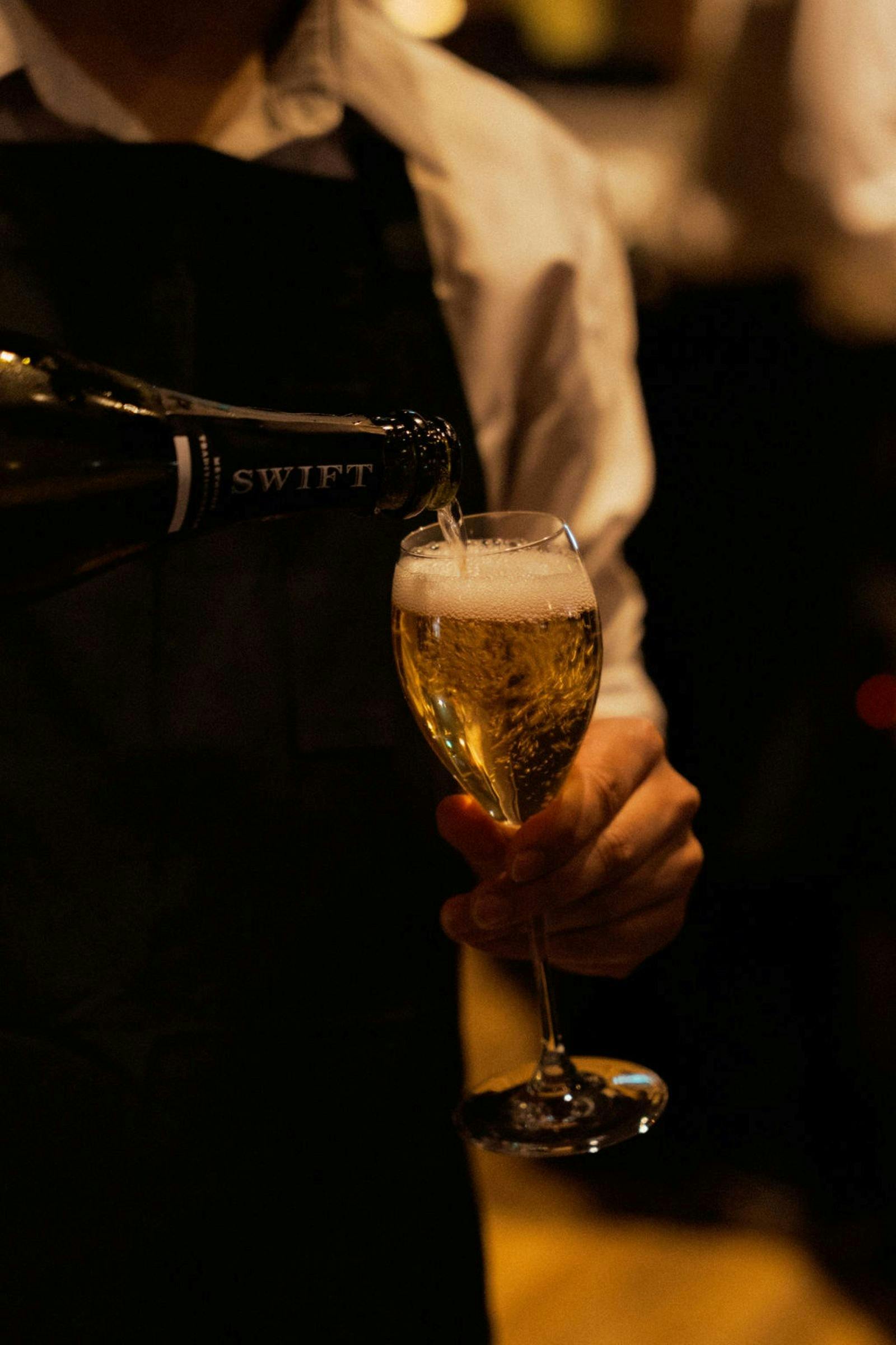 Pour glass of sparkling