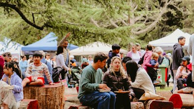 People sitting at the Haig Park Village Markets
