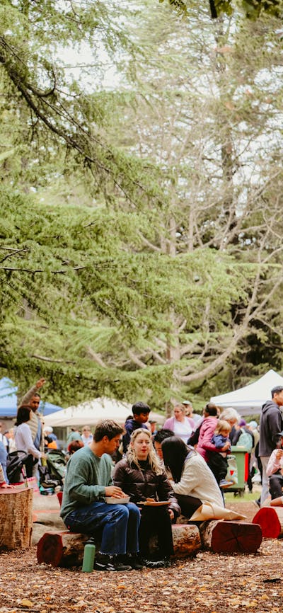 People sitting at the Haig Park Village Markets