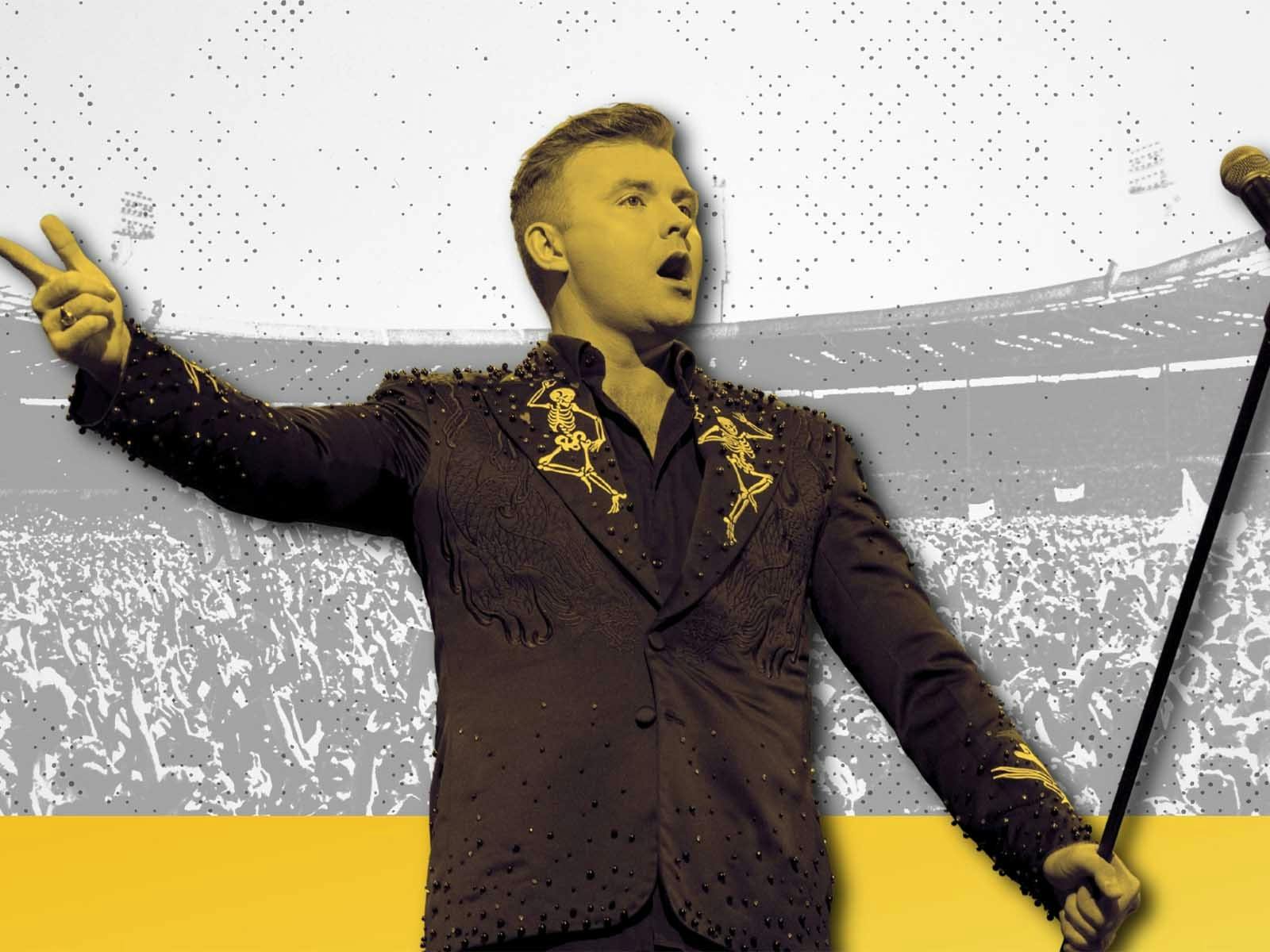 man with microphone singing with yellow tint