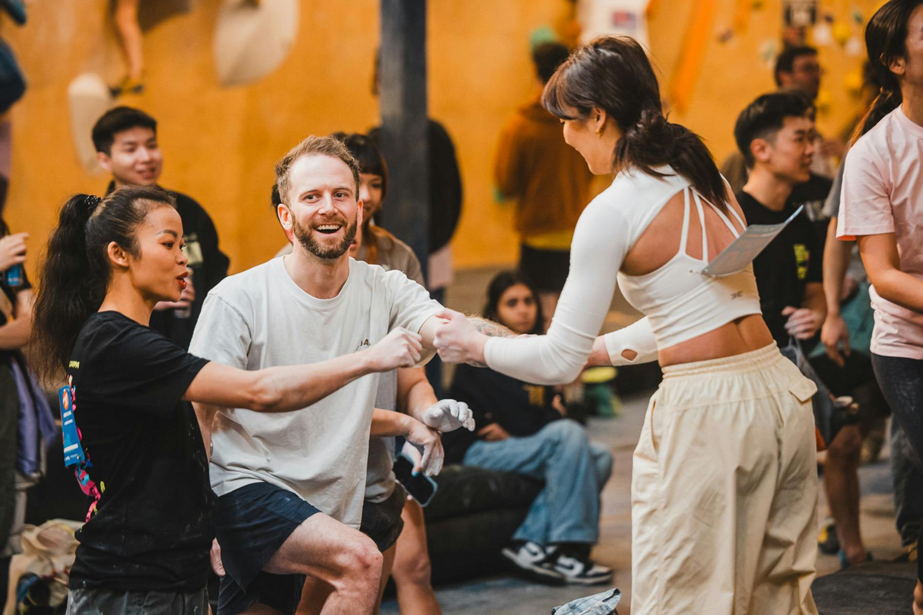 Fist-bumping as a congratulations from each climber