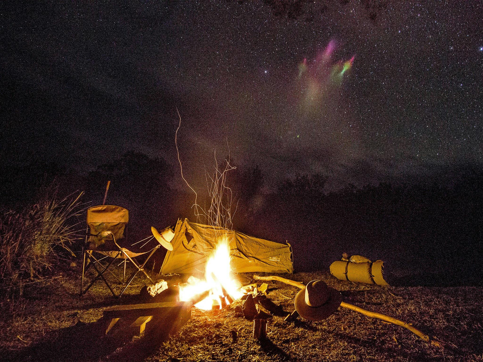 Campfire and camp at night. Campfire and camp at night.