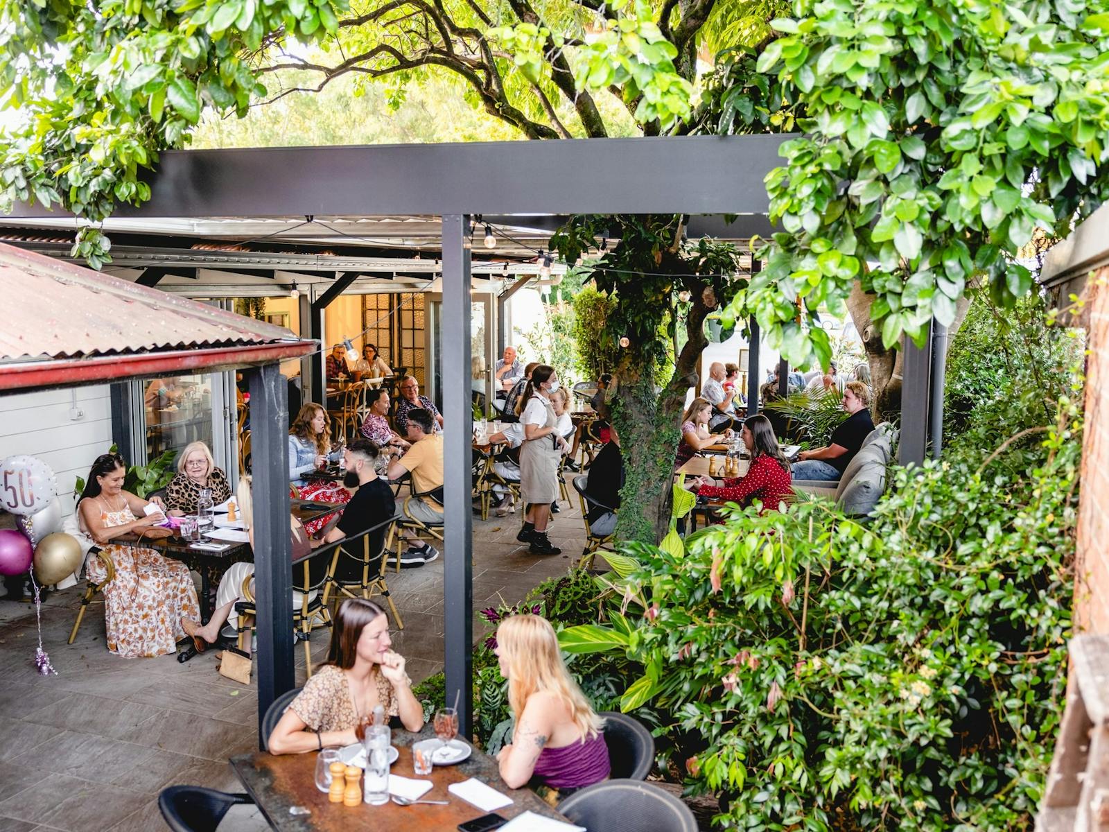 Green and leafy all-weather outdoor dining