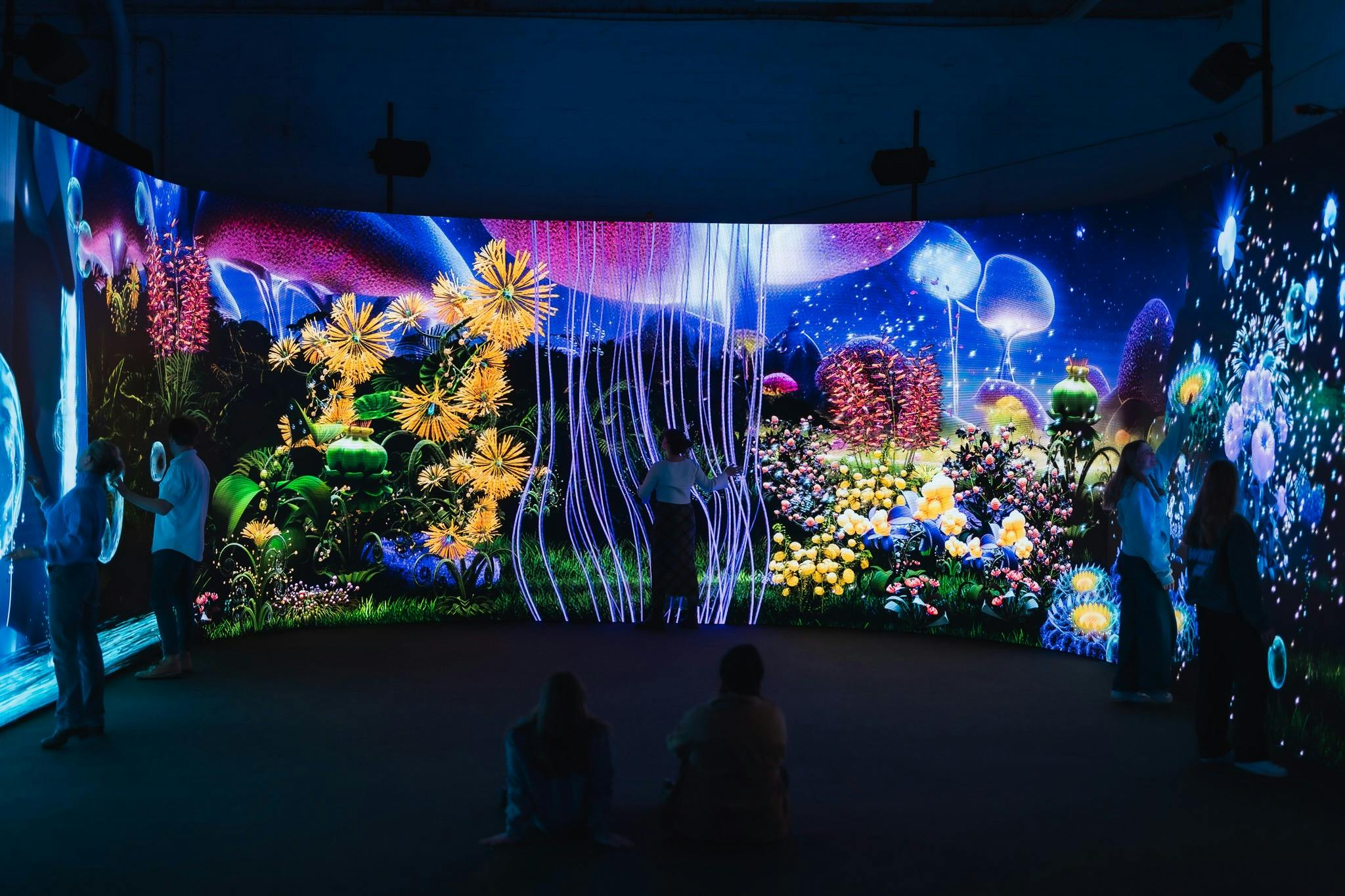A large LED screen with a mystical garden.
