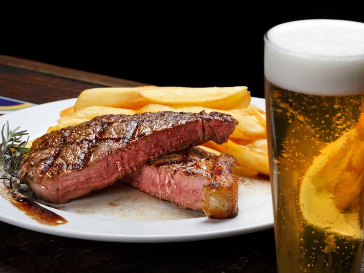 Steak with fries and beer