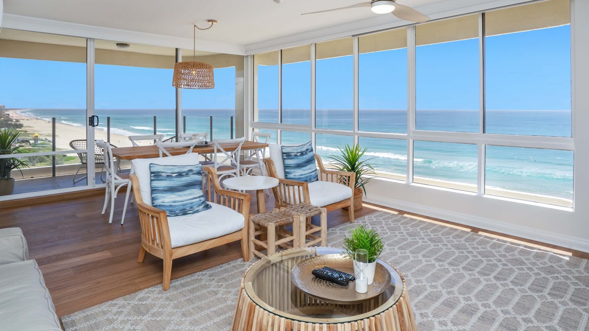 Open plan living room with beachfront views