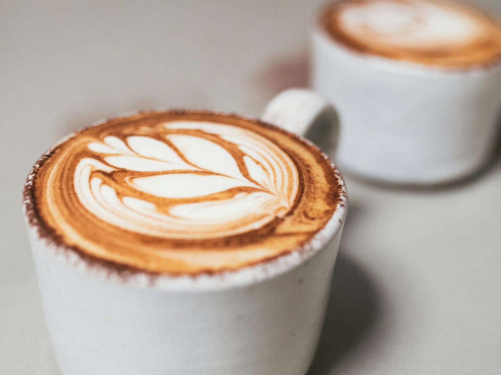 2 cappuccino coffees with latte art
