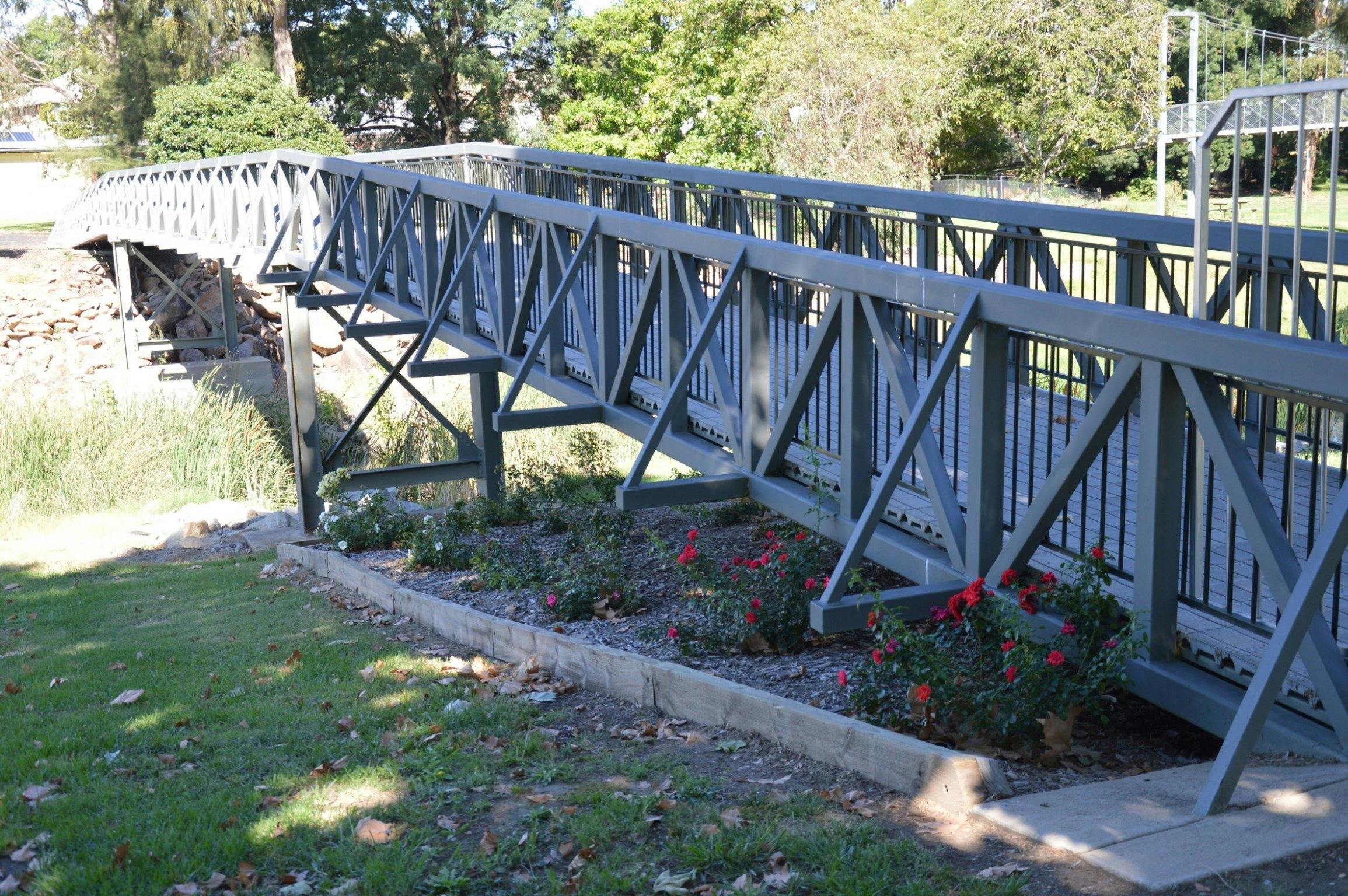 Two footbridges connect Caravan park to the main street, a swinging bridge and a rigid bridge