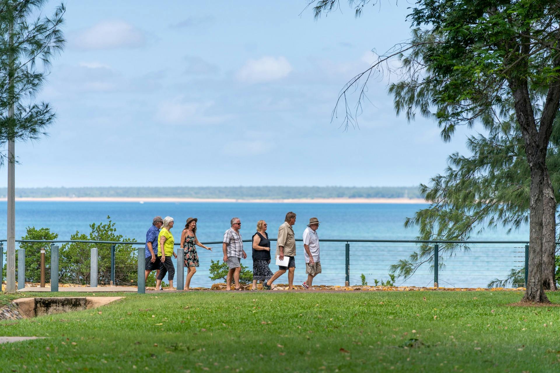 Group of people looking over Darwin Harbour.