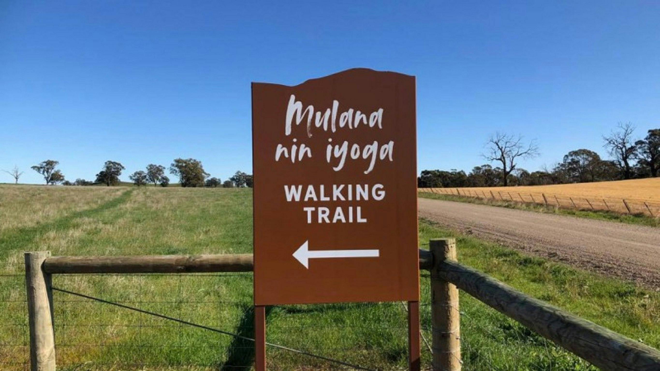 Mulana nin iyoga walking trail sign at trail head