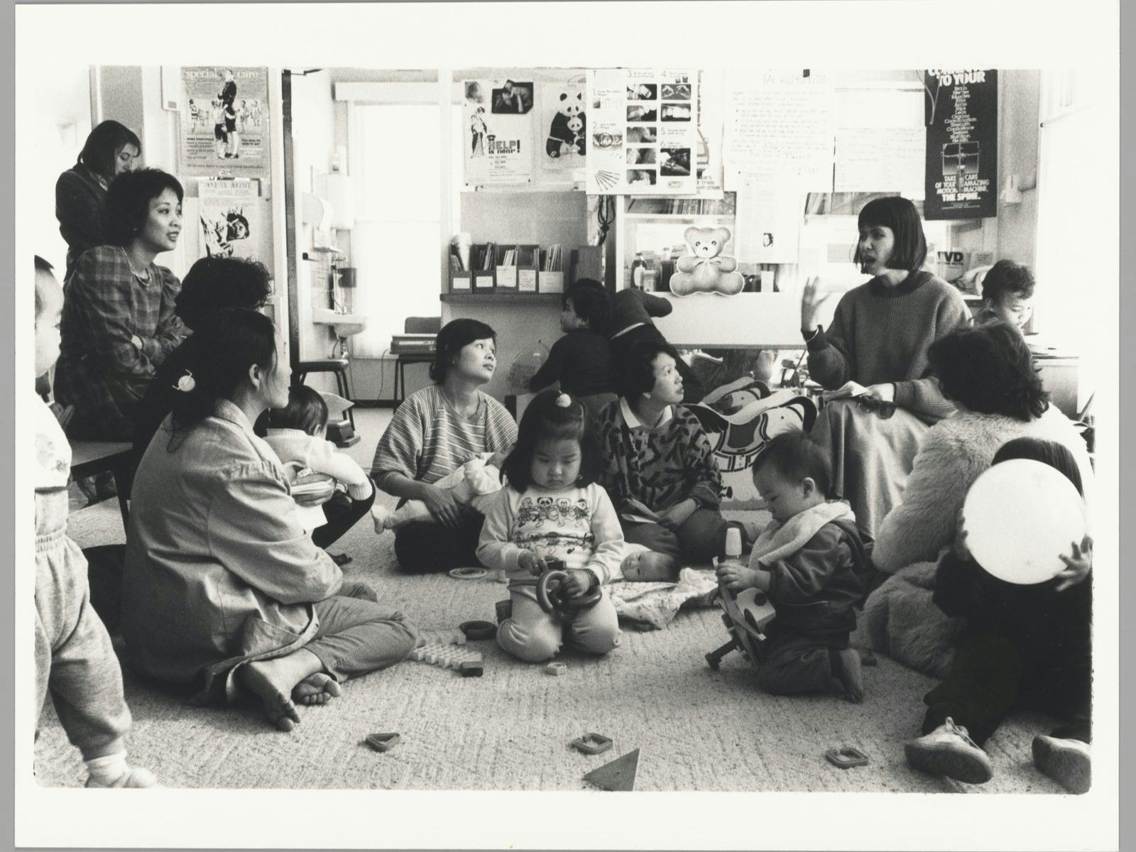 Credit: Angela Lynkushka (Born 1947) Women and children discuss health and child development issues