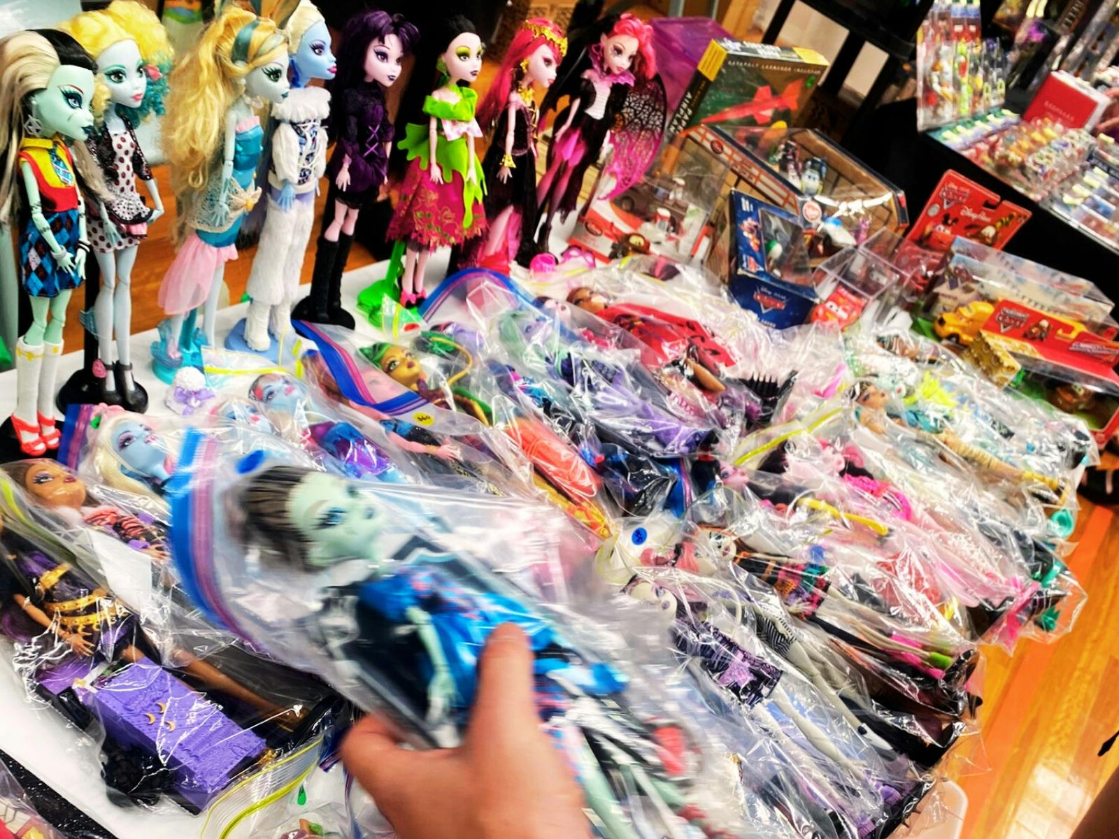 Out of box Monster high dolls on display on stall table