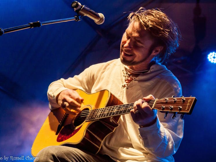 Darren Coggan playing guitar