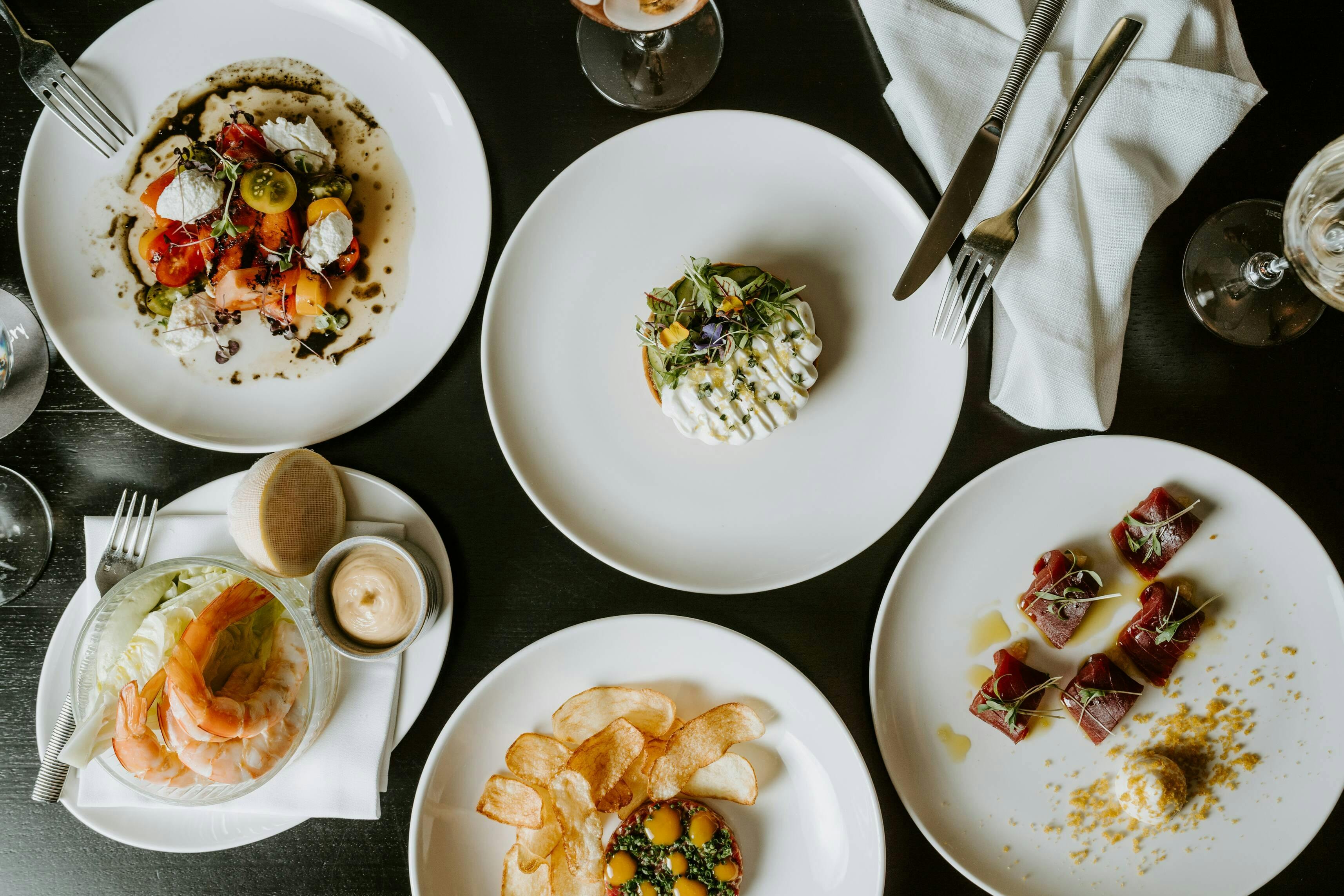 A variety of dishes placed on a table.