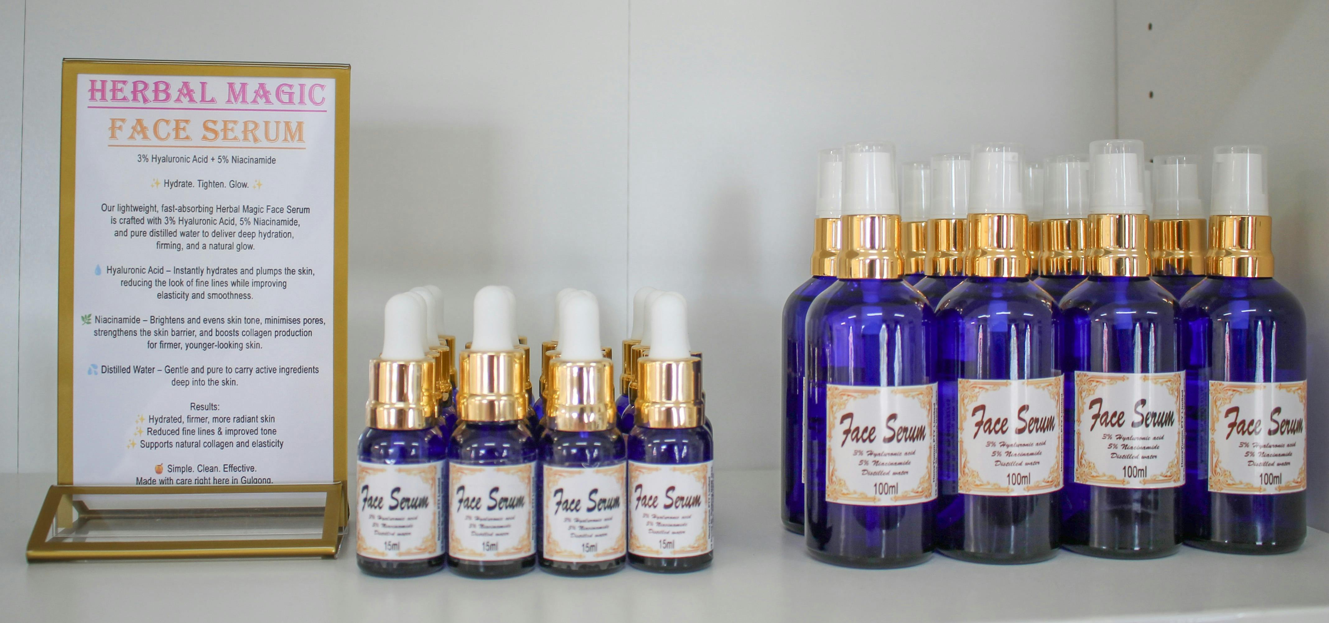 blue bottles of face serum in different sizes