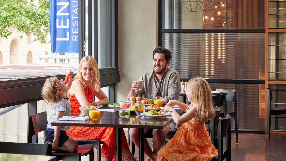 Family enjoining a breakfast at Lennons Restaurant - Brisbane City Breakfast