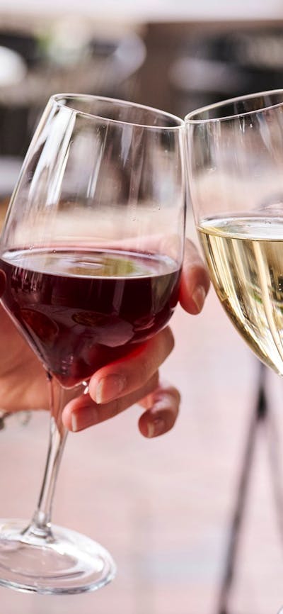Clinking red wine and sparkling