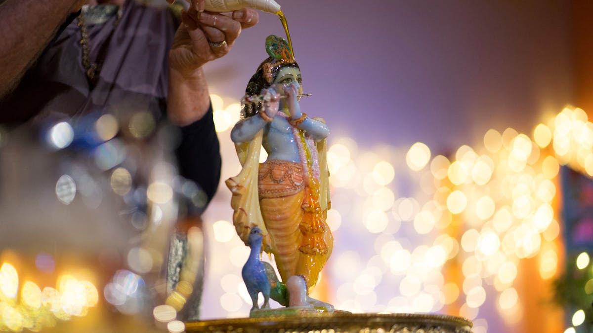 A photo of Krishna during a devotional ceremony