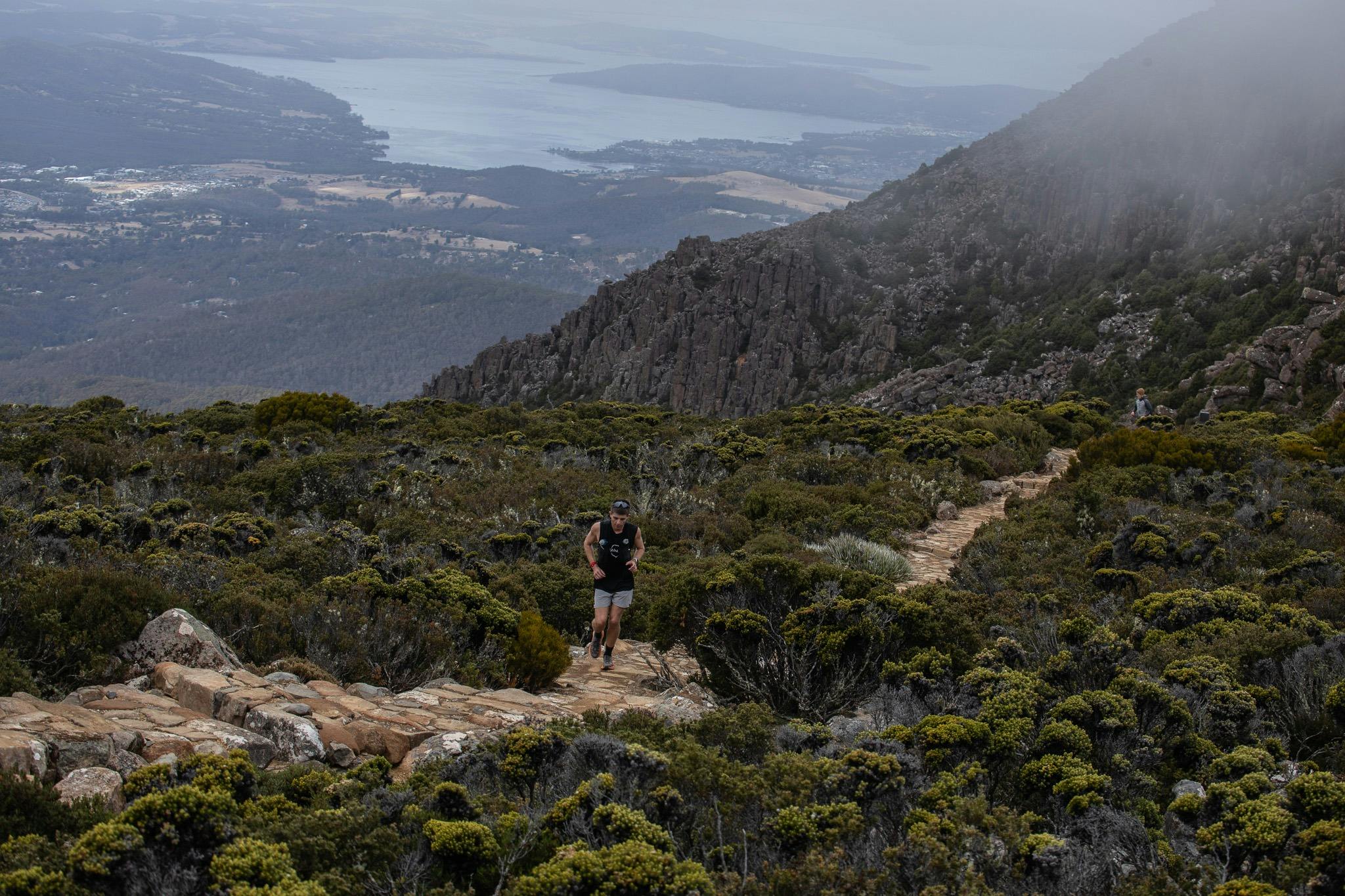 A runner on the trail near the Pinnacle of kunanyi/Mt Wellington