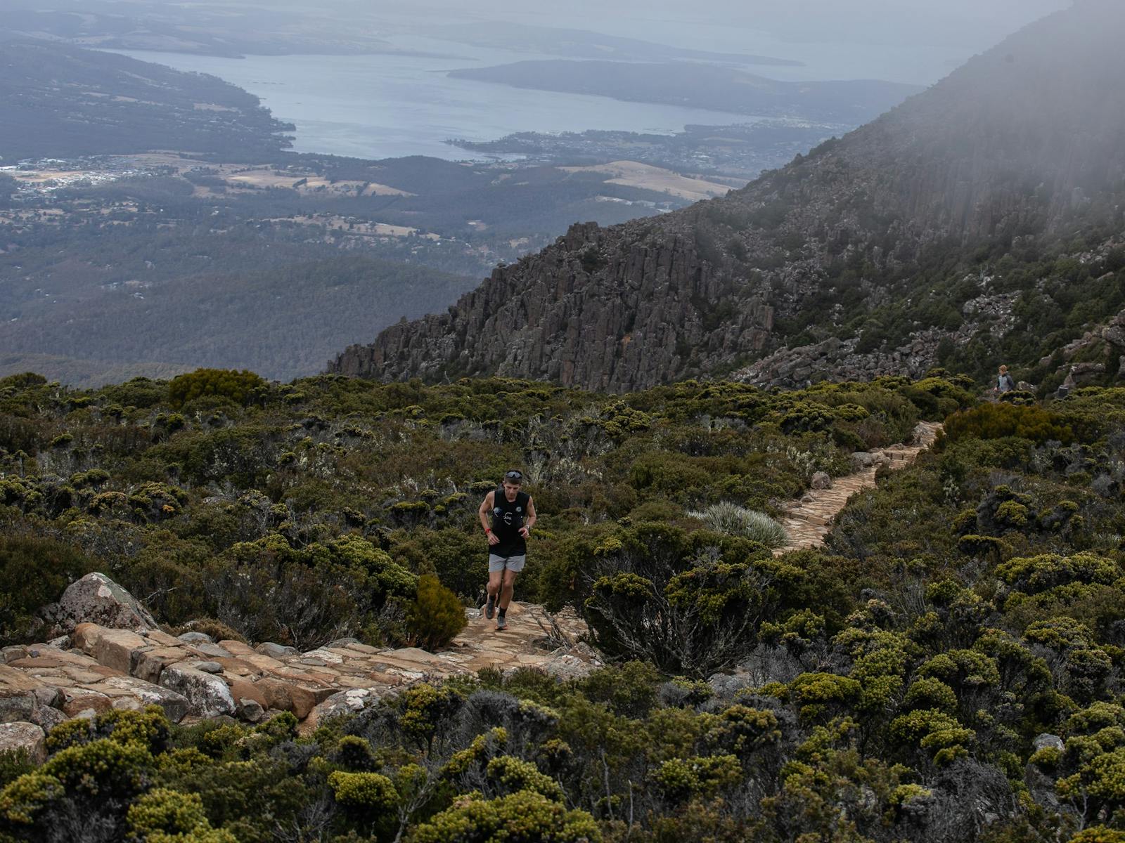 A runner on the trail near the Pinnacle of kunanyi/Mt Wellington
