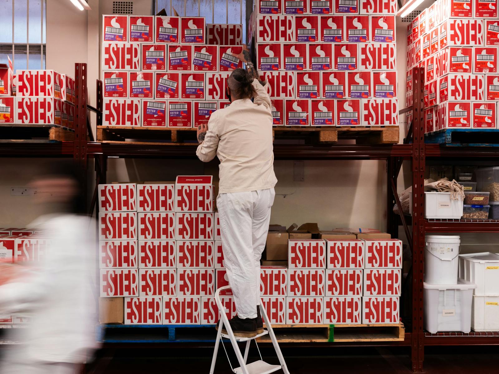 Felix stacking boxed in the distillery