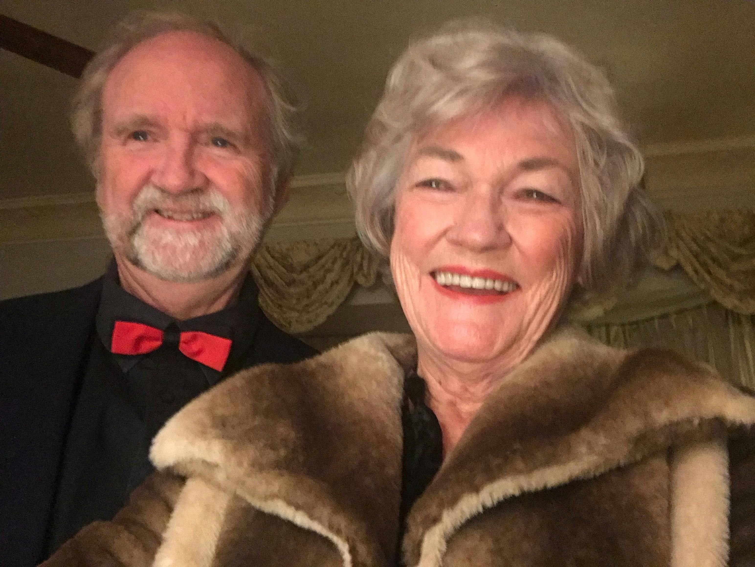 well dress couple smiling
