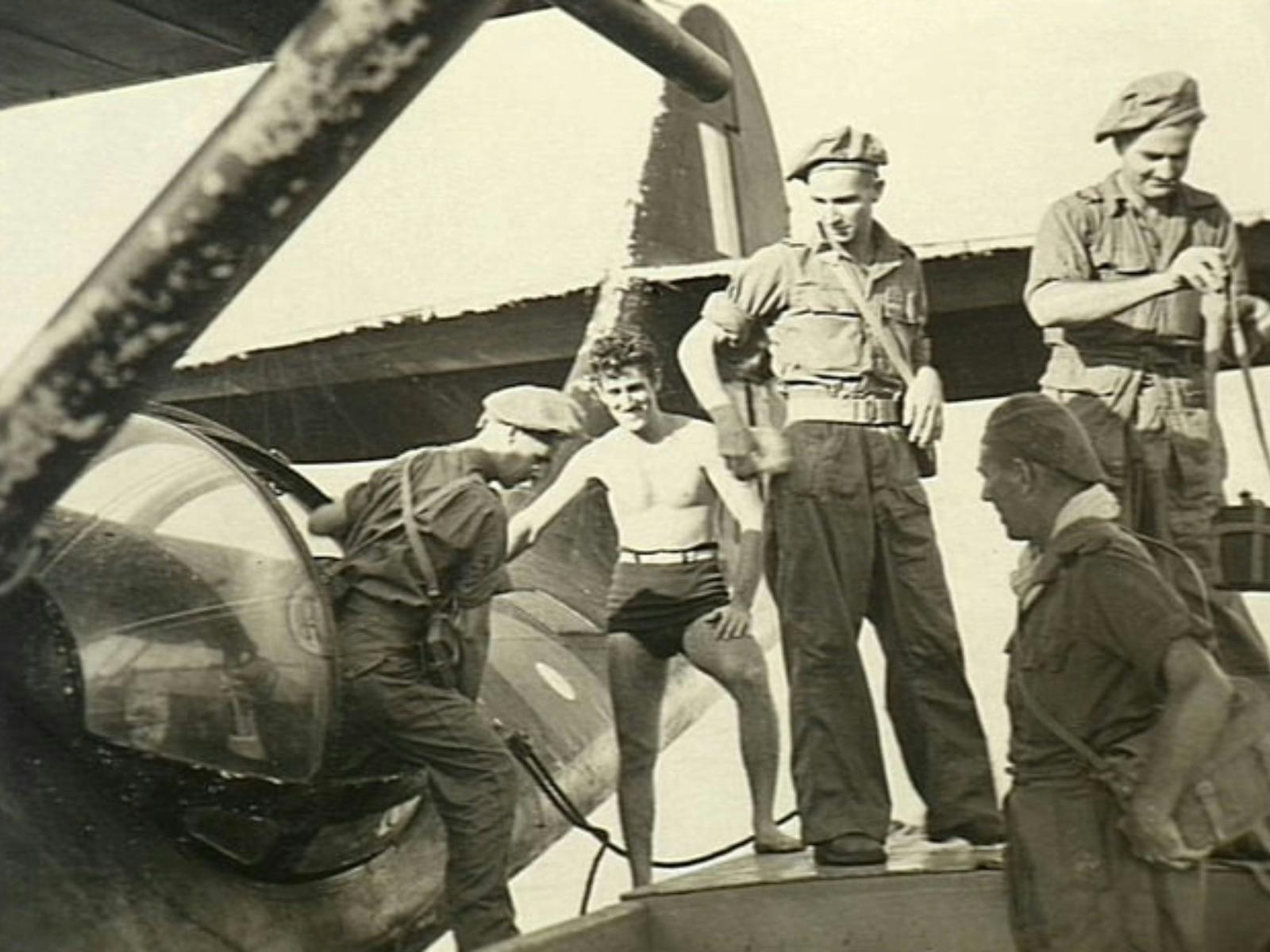 Prisoners of war (POWs) boarding a launch from the RAAF Consolidated Catalina