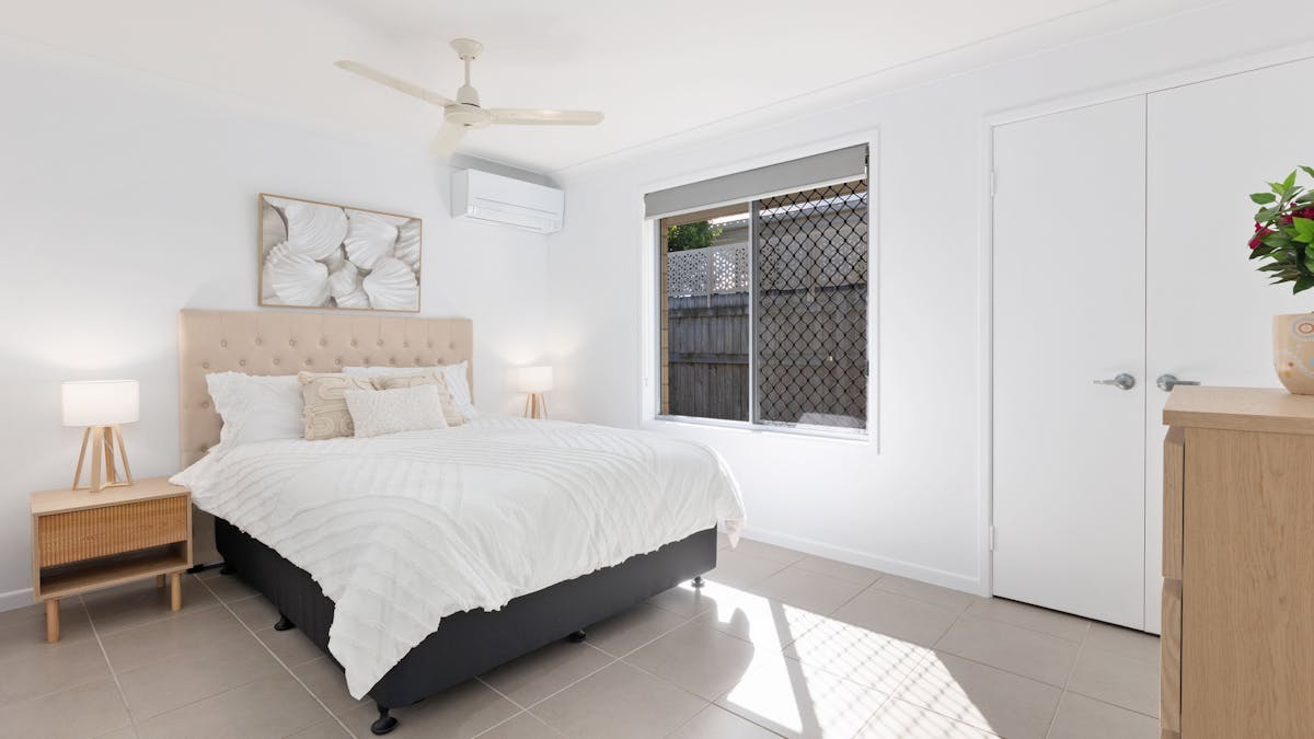 Bedroom 3 of 4 has a queen bed, aircon and ceiling fan