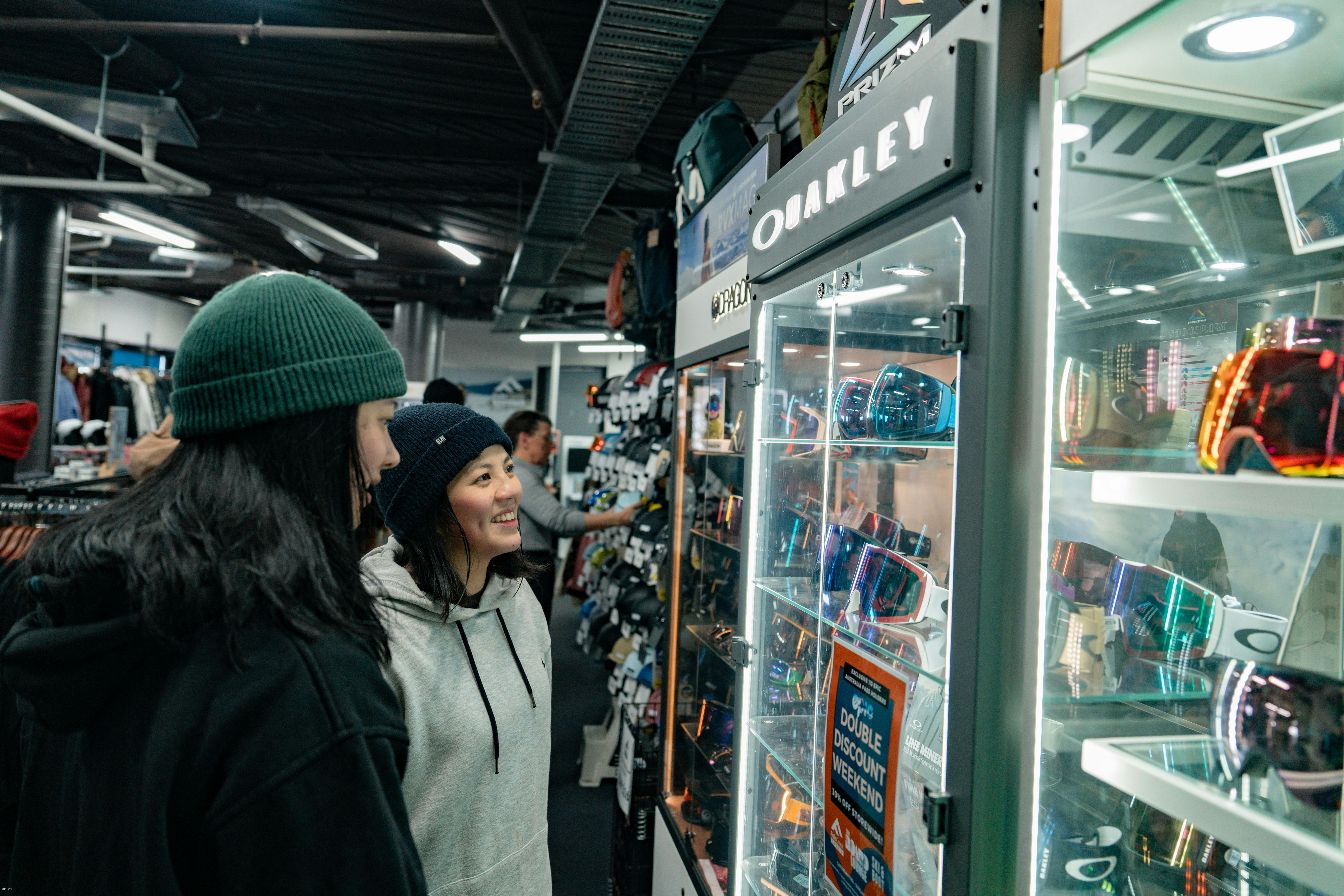 Couple looking at Oakley goggles