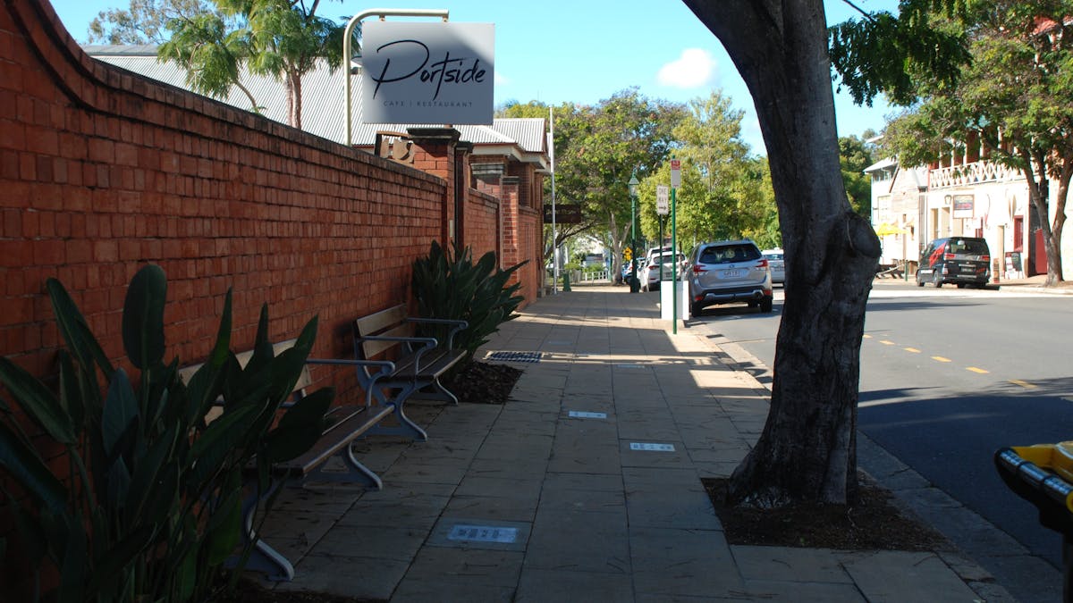 photo of a section of the Achievers Walk passing Portside Cafe's wall