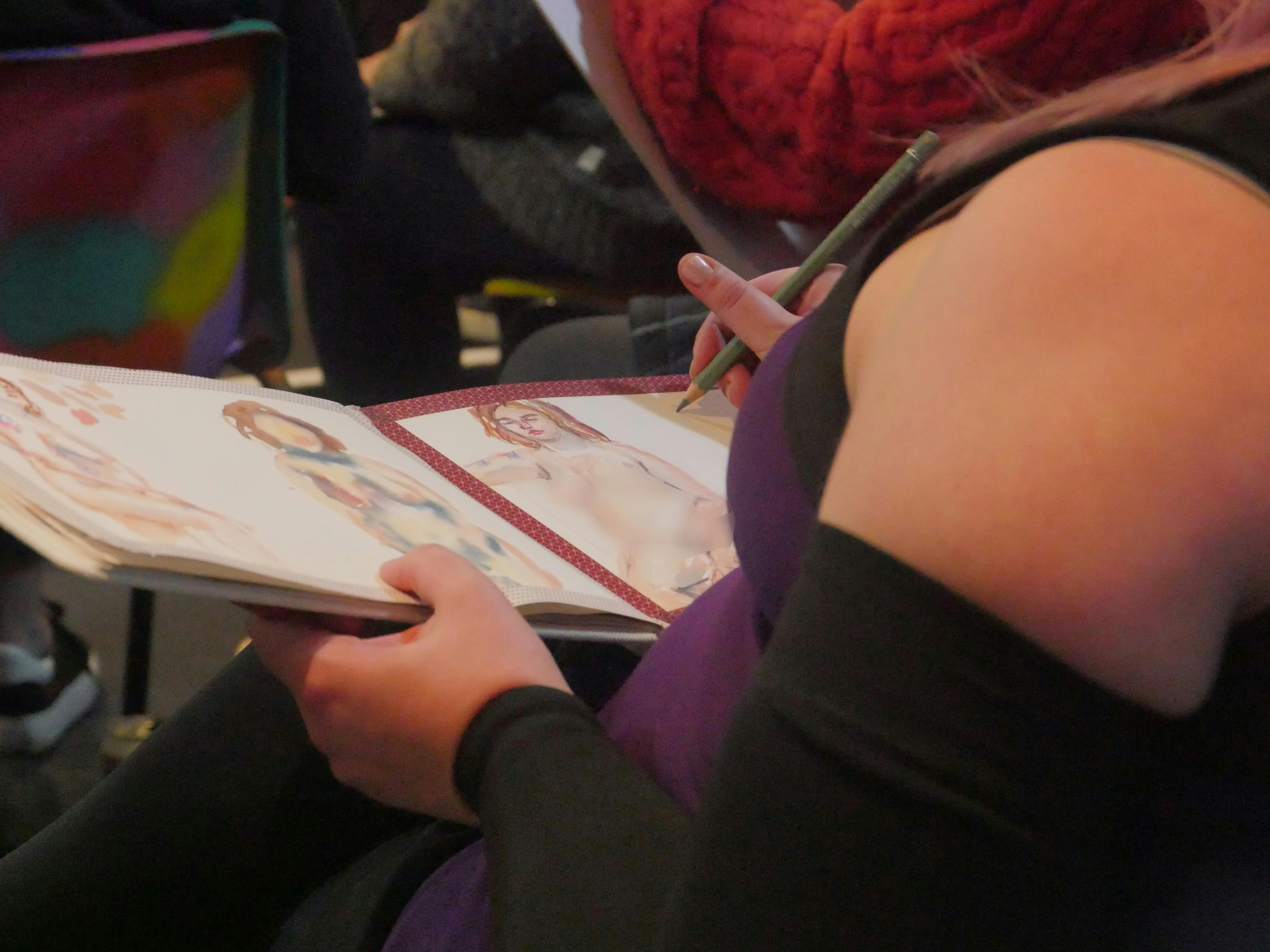 Photo of people creating life drawings